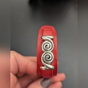 Red Leather Hand Crafted Bracelet with Metal Swirl Charm. Adjustable.